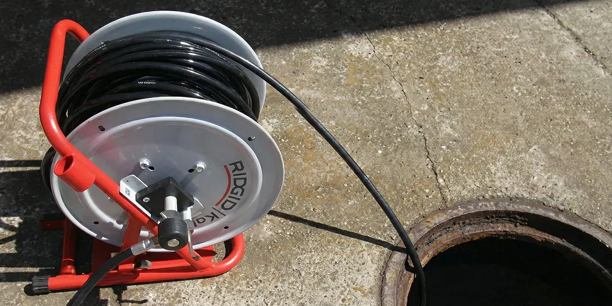 sewer rodding equipment prepared to clear clogged sewer lines in Miami, FL